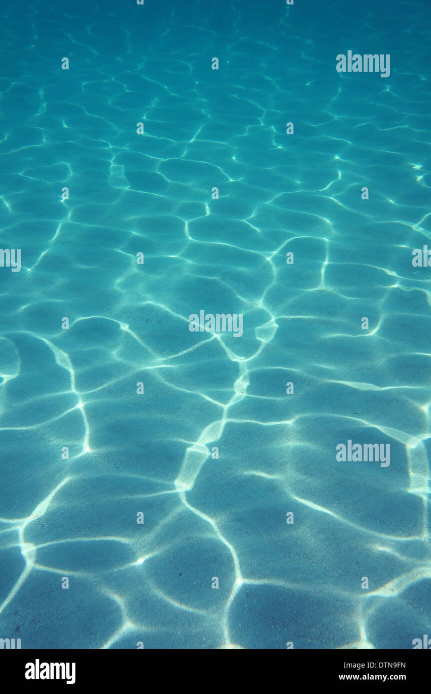 Underwater sunlight on the sand of ocean floor, Atlantic ocean Stock Photo