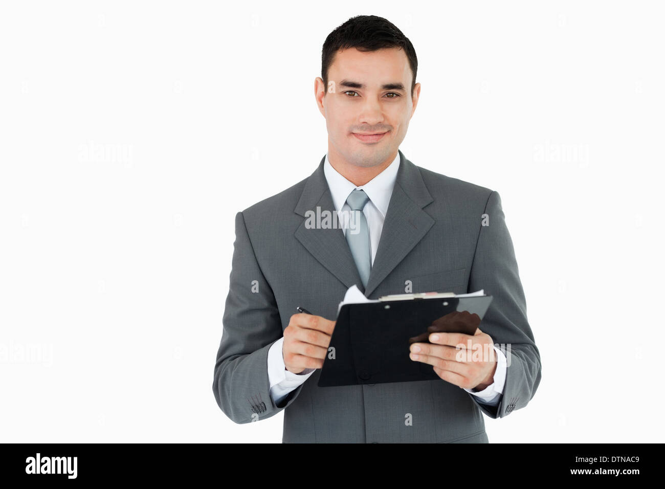 Businessman with clipboard and pen Stock Photo - Alamy