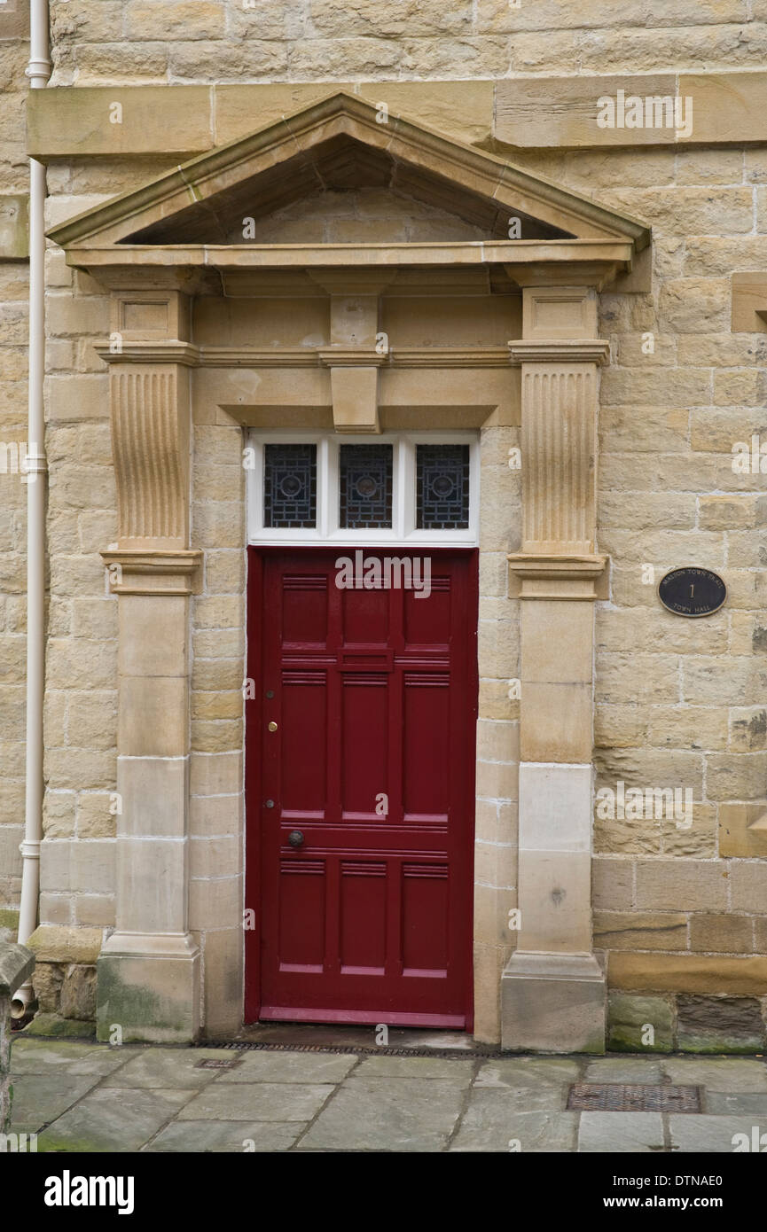 Red wooden front door of period house in Malton North Yorkshire England