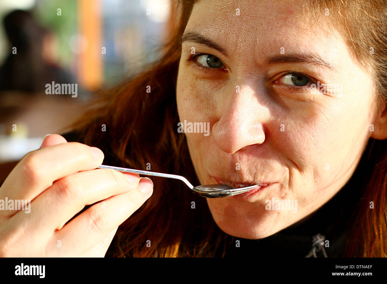 Young Turkish Women Tasting Sweet Desert Stock Photo