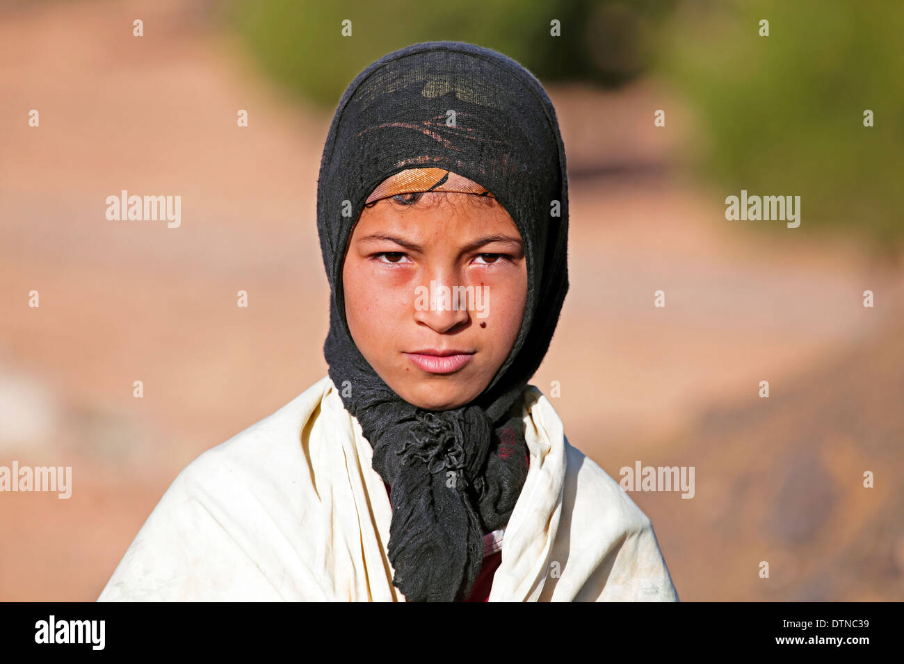 Young nomad woman in the desert Stock Photo