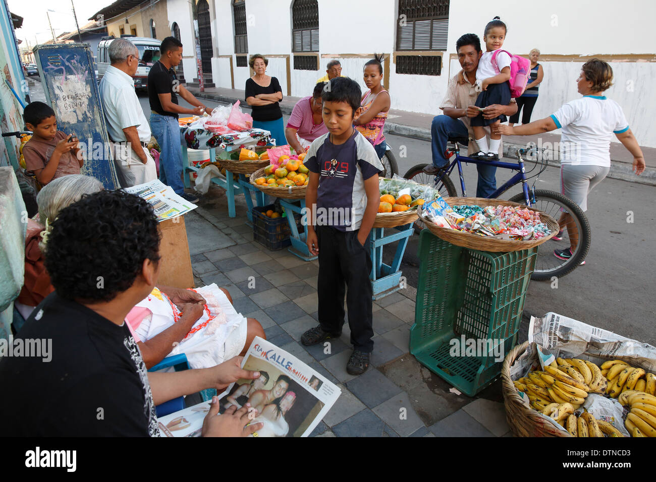 People gather on a street corner, Granada, Nicaragua Stock Photo