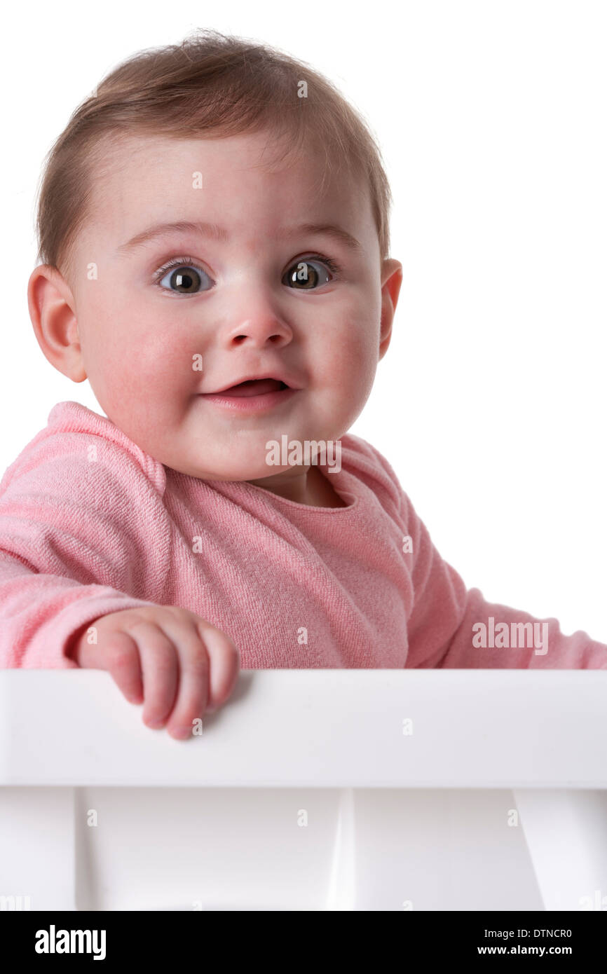 Portrait of a baby girl with large brown eyes on white background Portrait of a baby girl with large brown eyes on white background