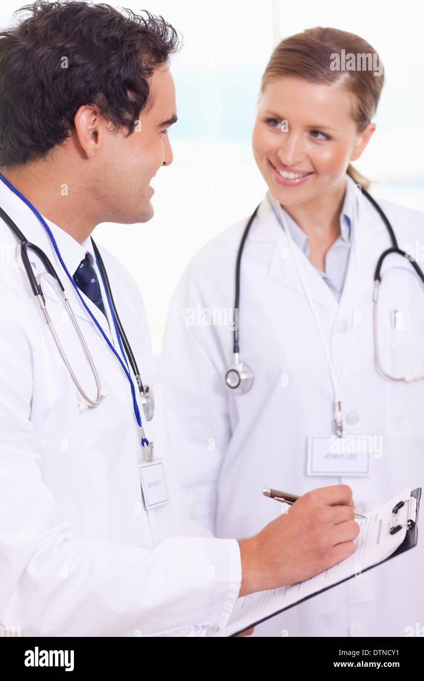 Medical assistants with patient record Stock Photo Alamy
