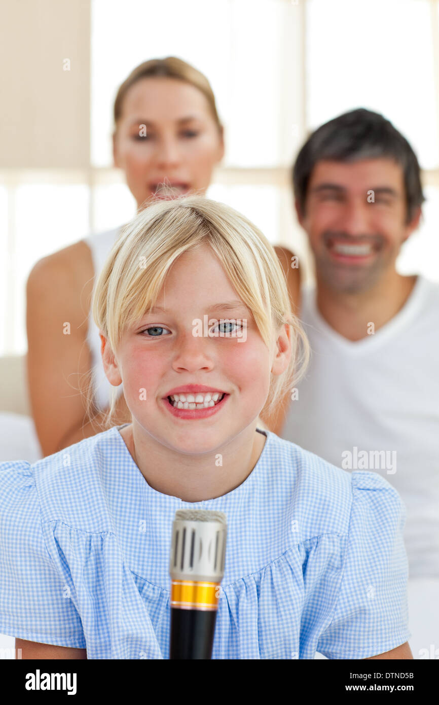 Cute little girl singing with a microphone Stock Photo Alamy