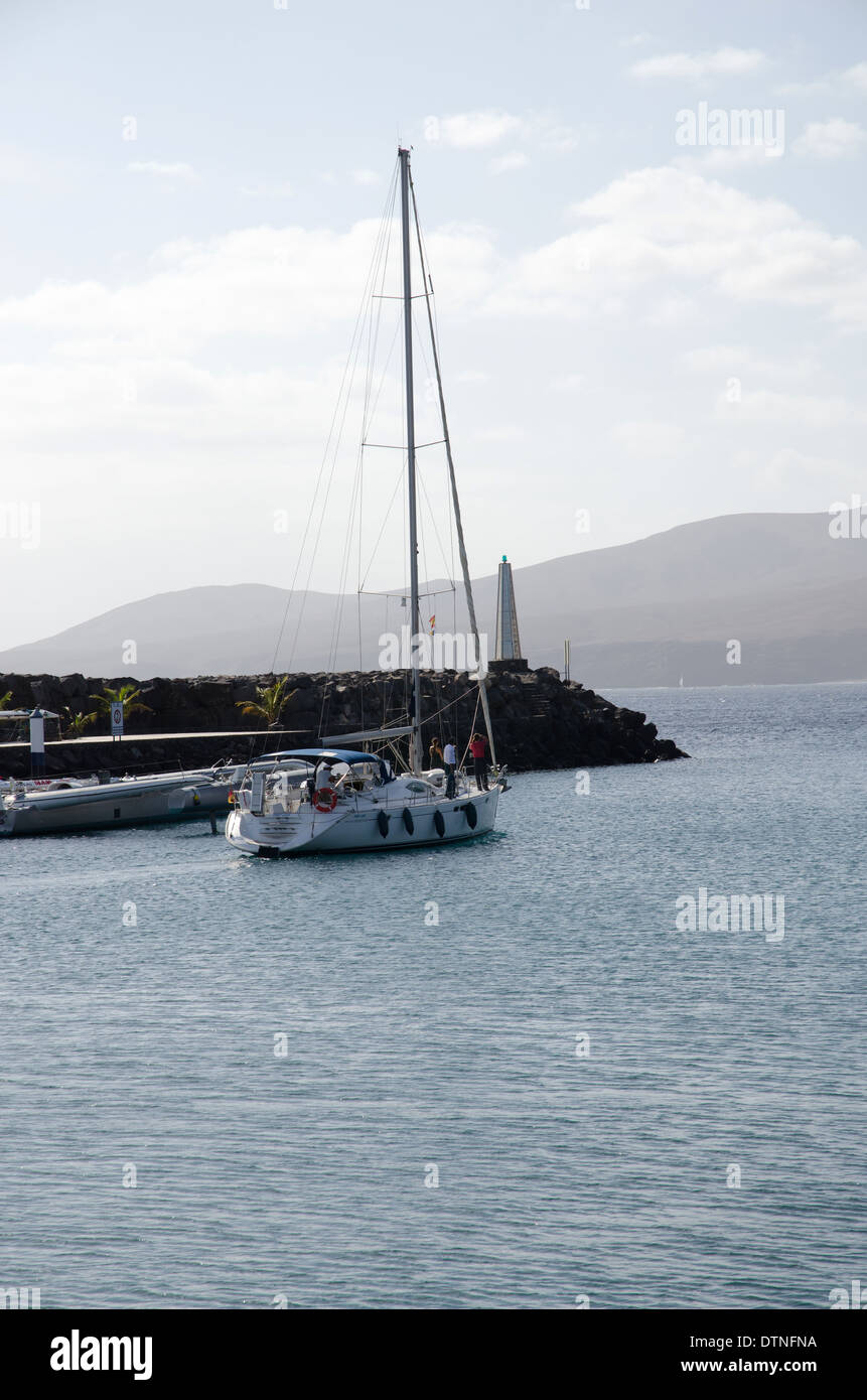 Single yacht leaving the marina at Puerto Calero Lanzarote Canary Islands Stock Photo