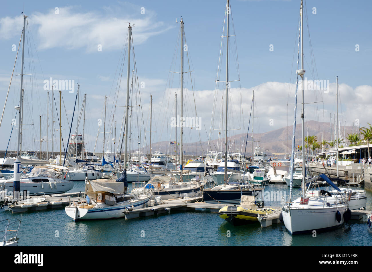 Yachts and boats moored at the marina in Puerto Calero Lanzarote Canary Islands Stock Photo