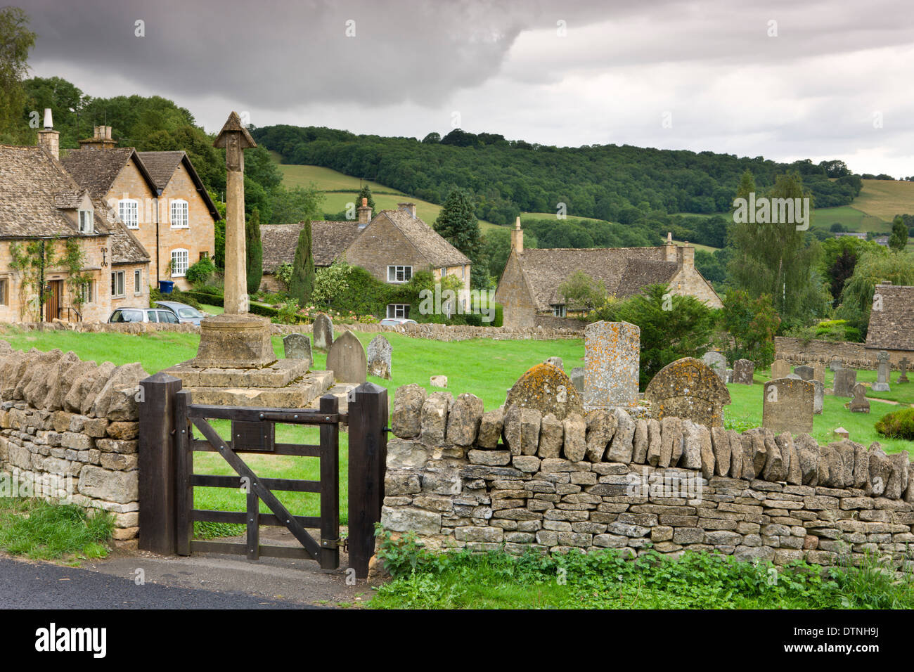 Graveyard and cottages in the pretty Cotswolds village of Snowshill, Worcestershire, England. Summer (July) 2010. Stock Photo