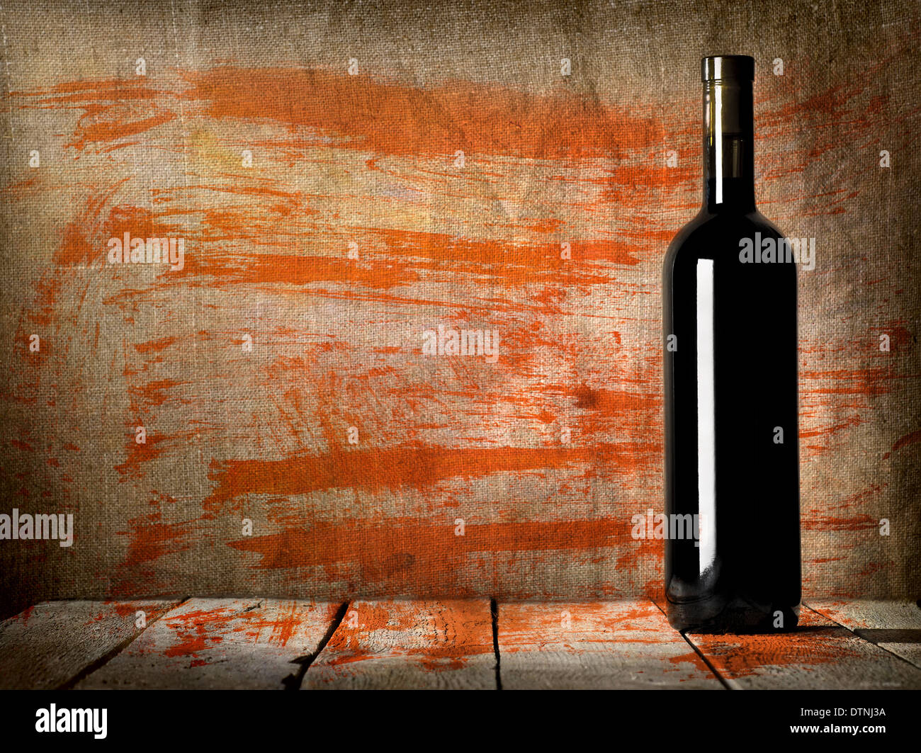 Black bottle of wine on the background of the canvas Stock Photo