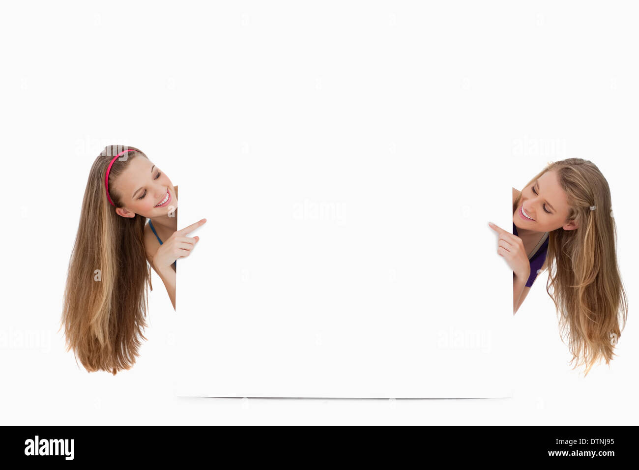 Two long hair women back of a blank sign Stock Photo - Alamy