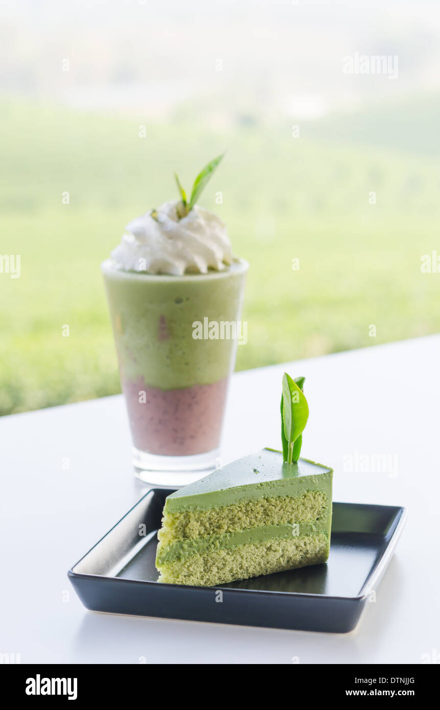 Green tea cake and smoothie with whipped cream Stock Photo