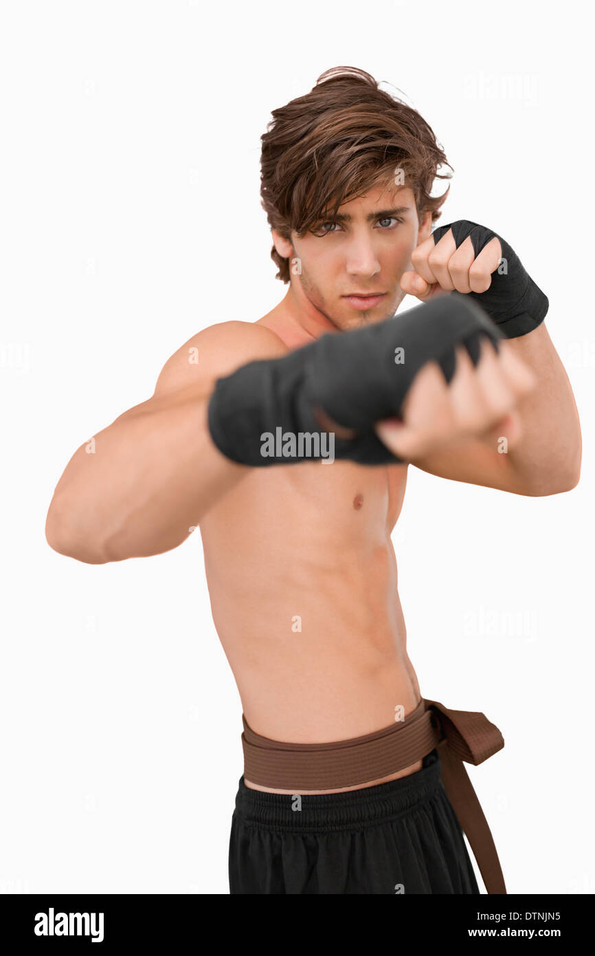 Martial arts fighter in fighting pose Stock Photo
