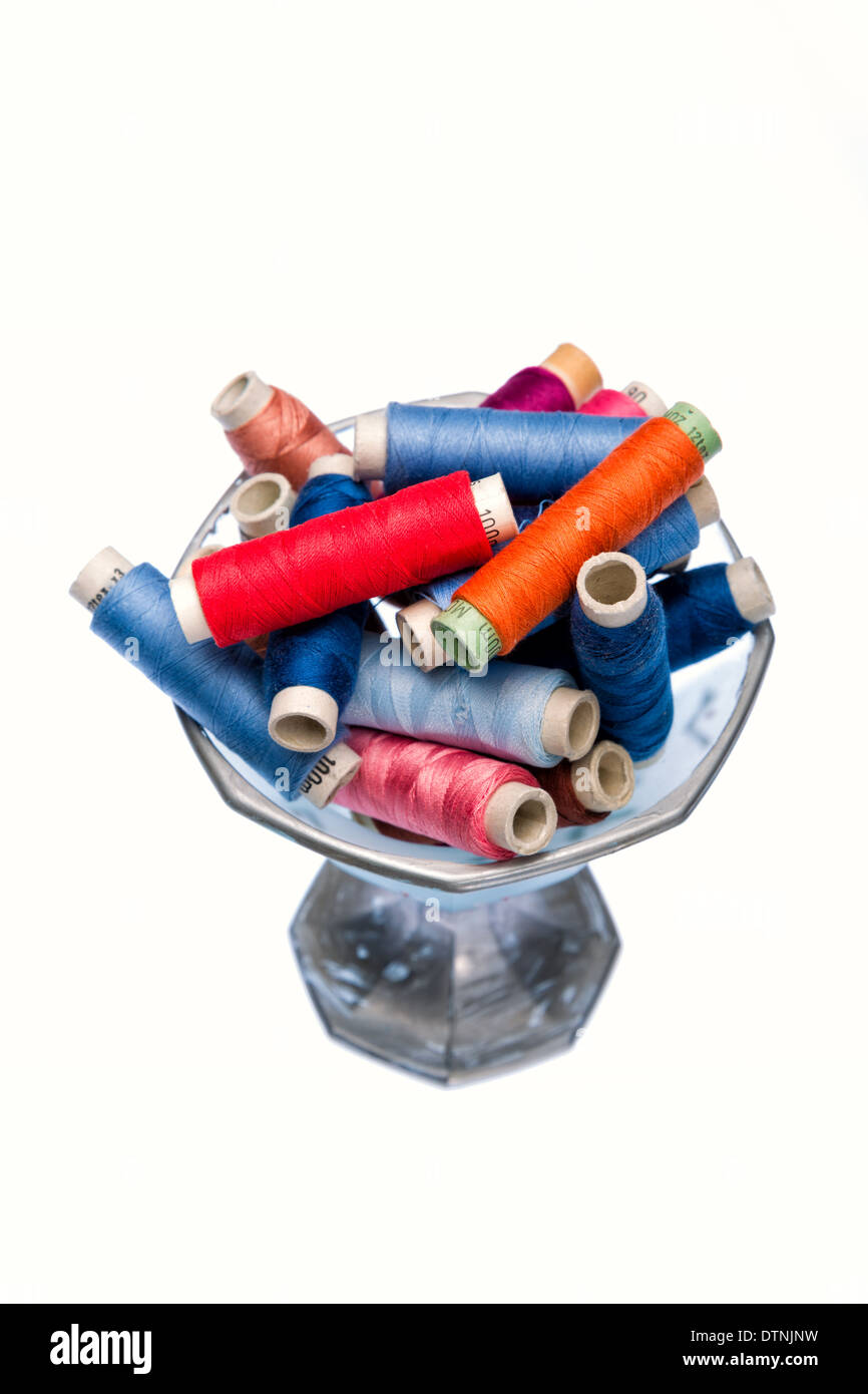 Multi colored yarns and tools to tailor Stock Photo Alamy