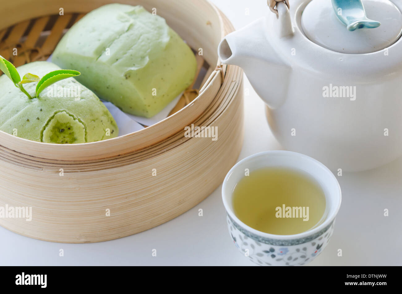 hot tea and green Mantou (Chinese steamed buns) Stock Photo