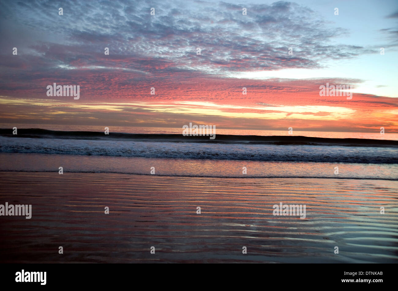 Colorful sunset sky over Pacific ocean Stock Photo