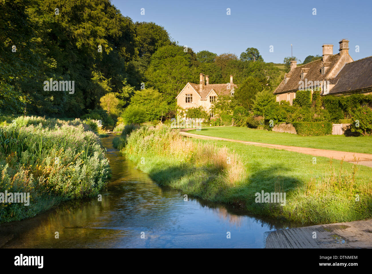 Picturesque farmhouses beside the River Eye in the Cotswolds village of