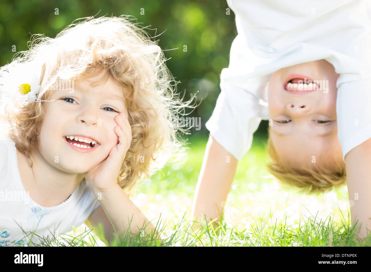 Happy children playing Stock Photo - Alamy