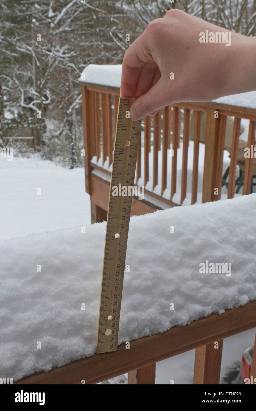 Measuring snow depth with ruler hires stock photography and images Alamy