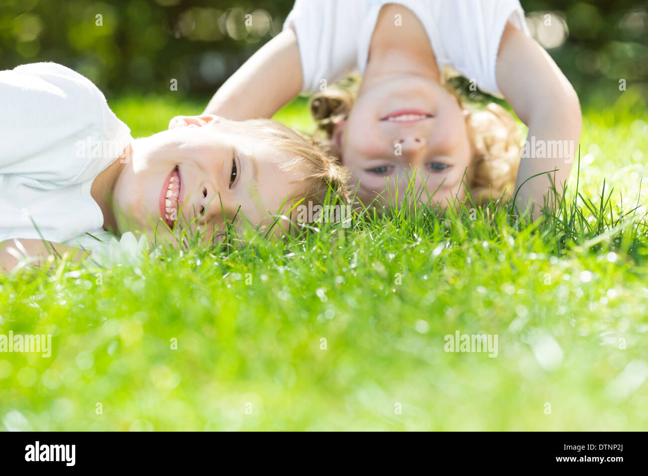Happy children playing Stock Photo - Alamy