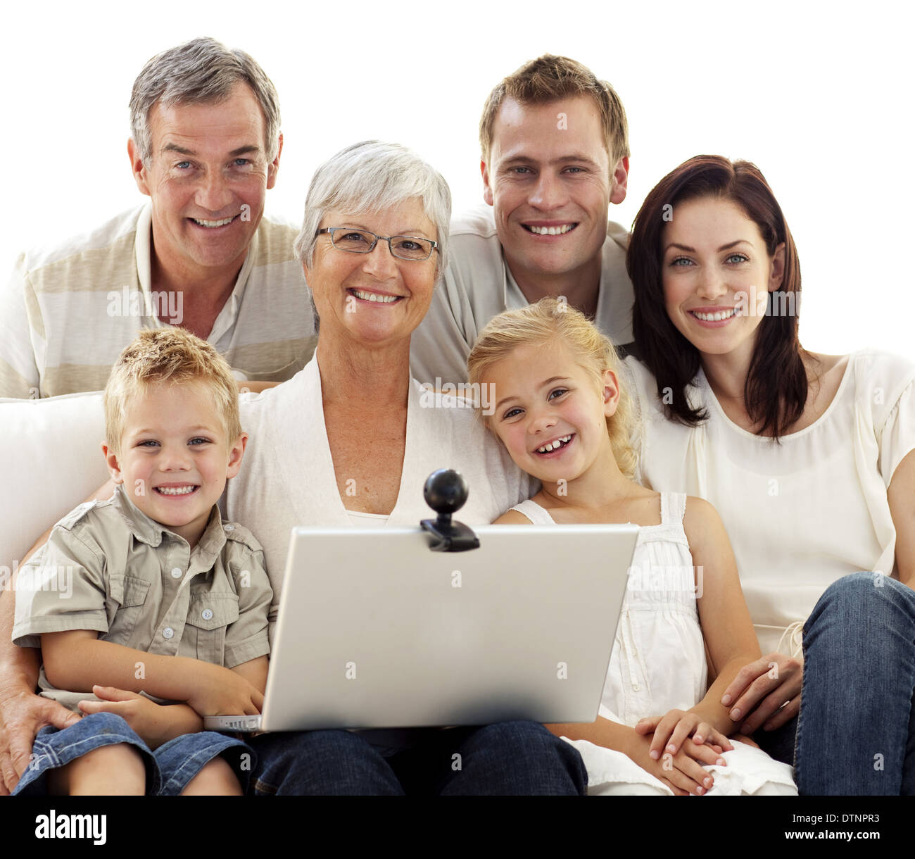 Happy family using a laptop at home Stock Photo - Alamy