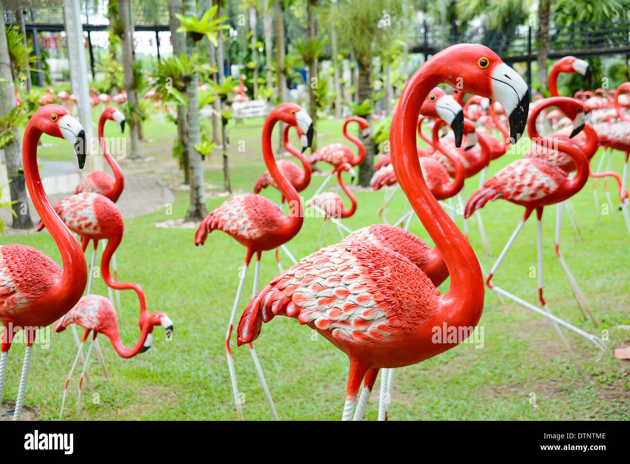 A beautiful group of flamingo sculptures at Nong Nooch Tropical Garden, Thailand Stock Photo