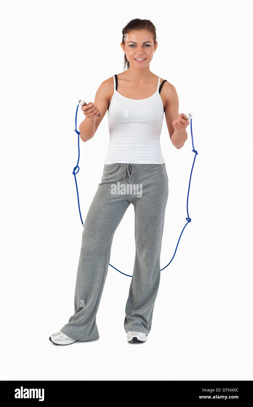 Young woman about to start jump roping Stock Photo - Alamy