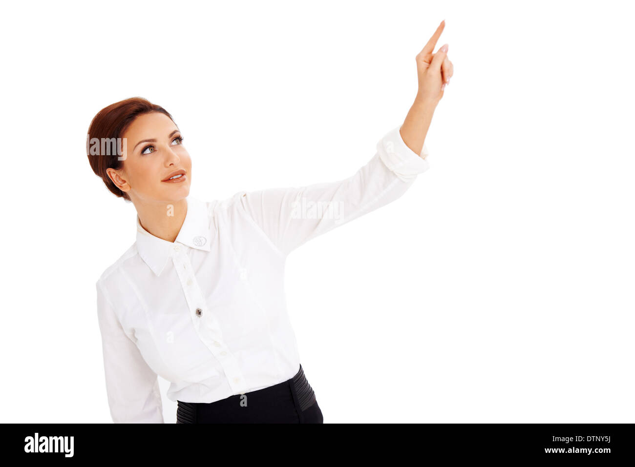 Beautiful woman pointing above her head Stock Photo