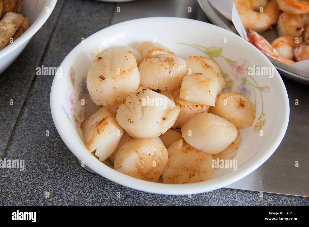 Cooked Pan Seared Sea Scallops as Ingredients for Chinese Big Feast Bowl Closeup Stock Photo