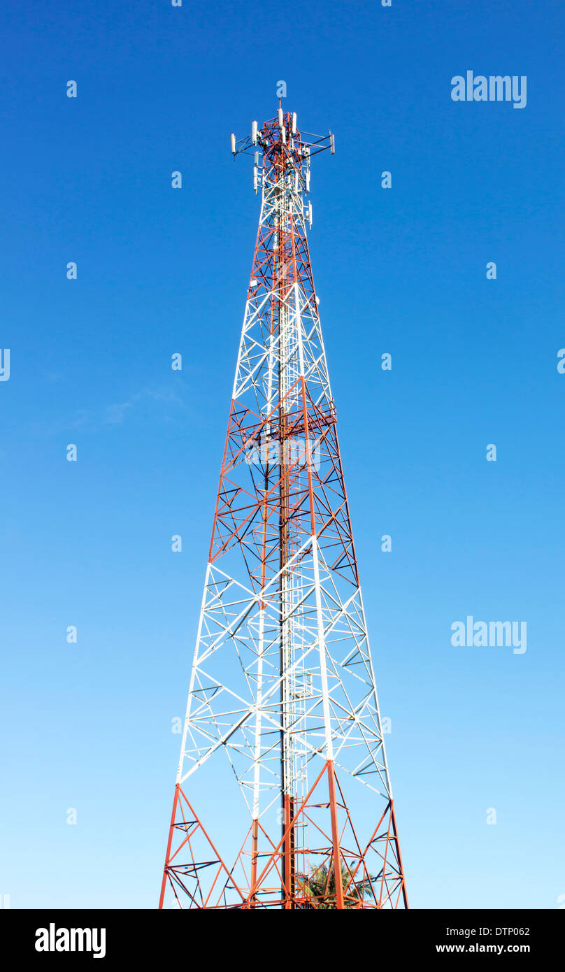 Communication tower radio mast signal and the sky dark. Stock Photo