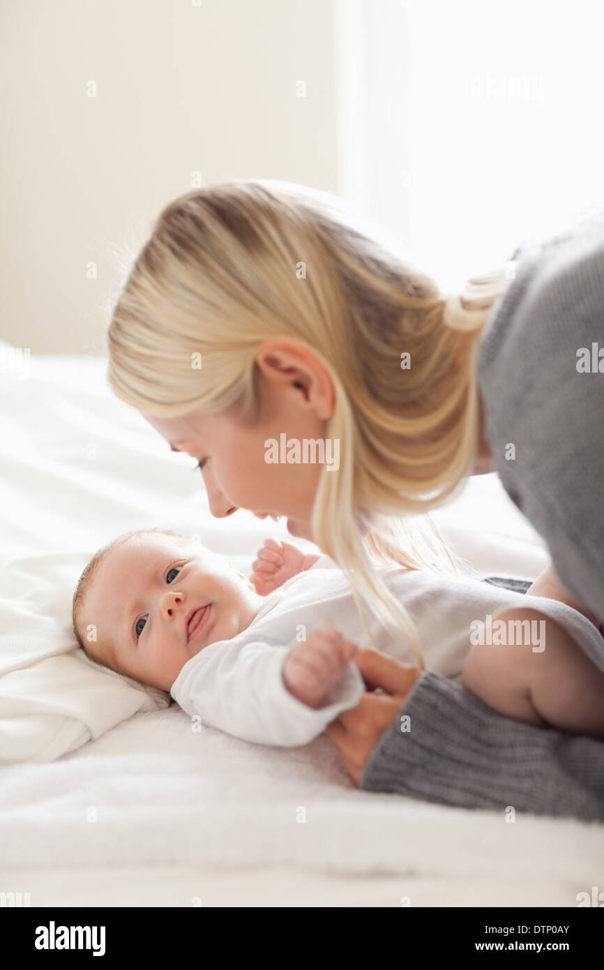 Affectionate mom cuddling her newborn Stock Photo