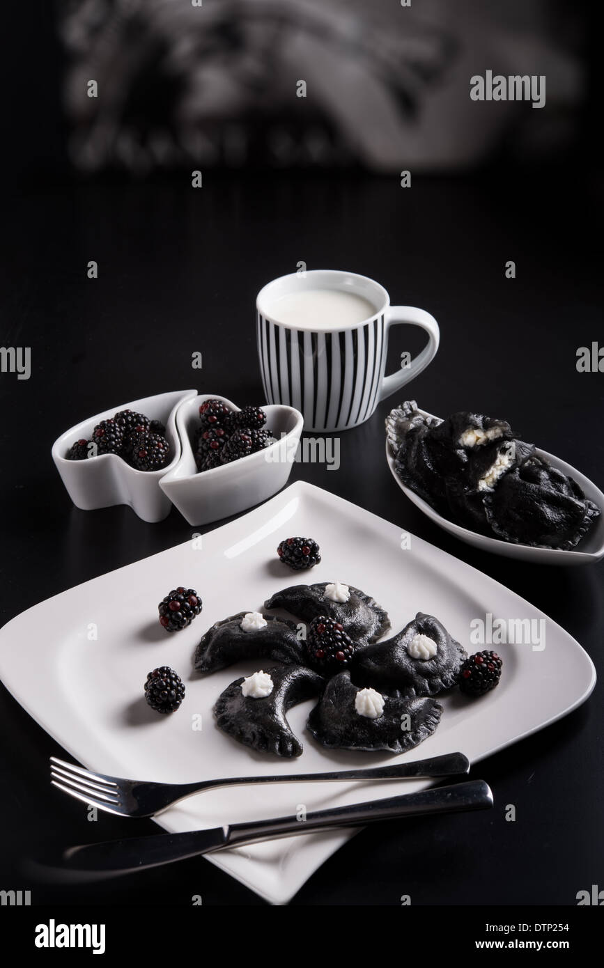 sweeten pierogi with blackberries - B & W Stock Photo
