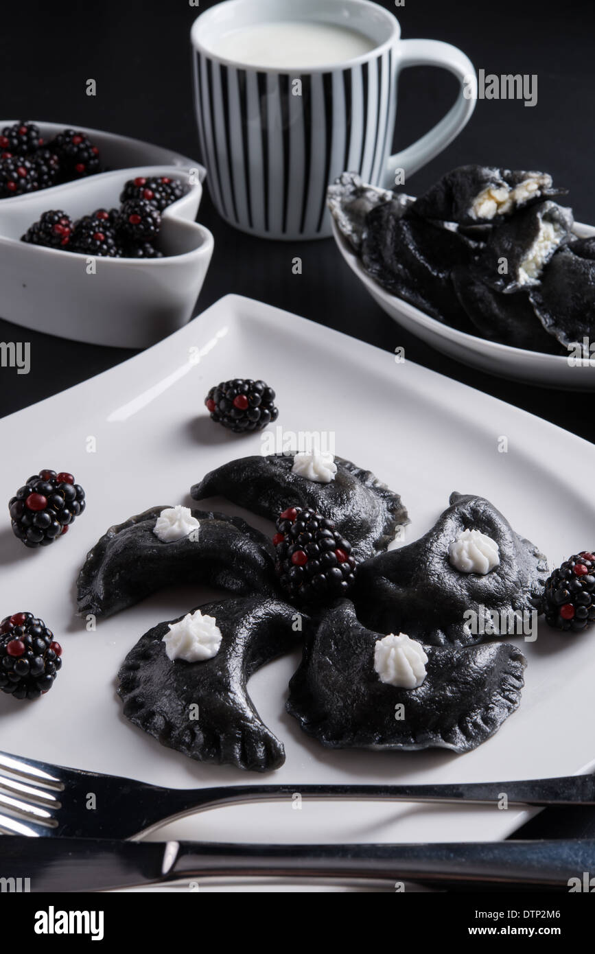 sweeten pierogi with blackberries - B & W Stock Photo