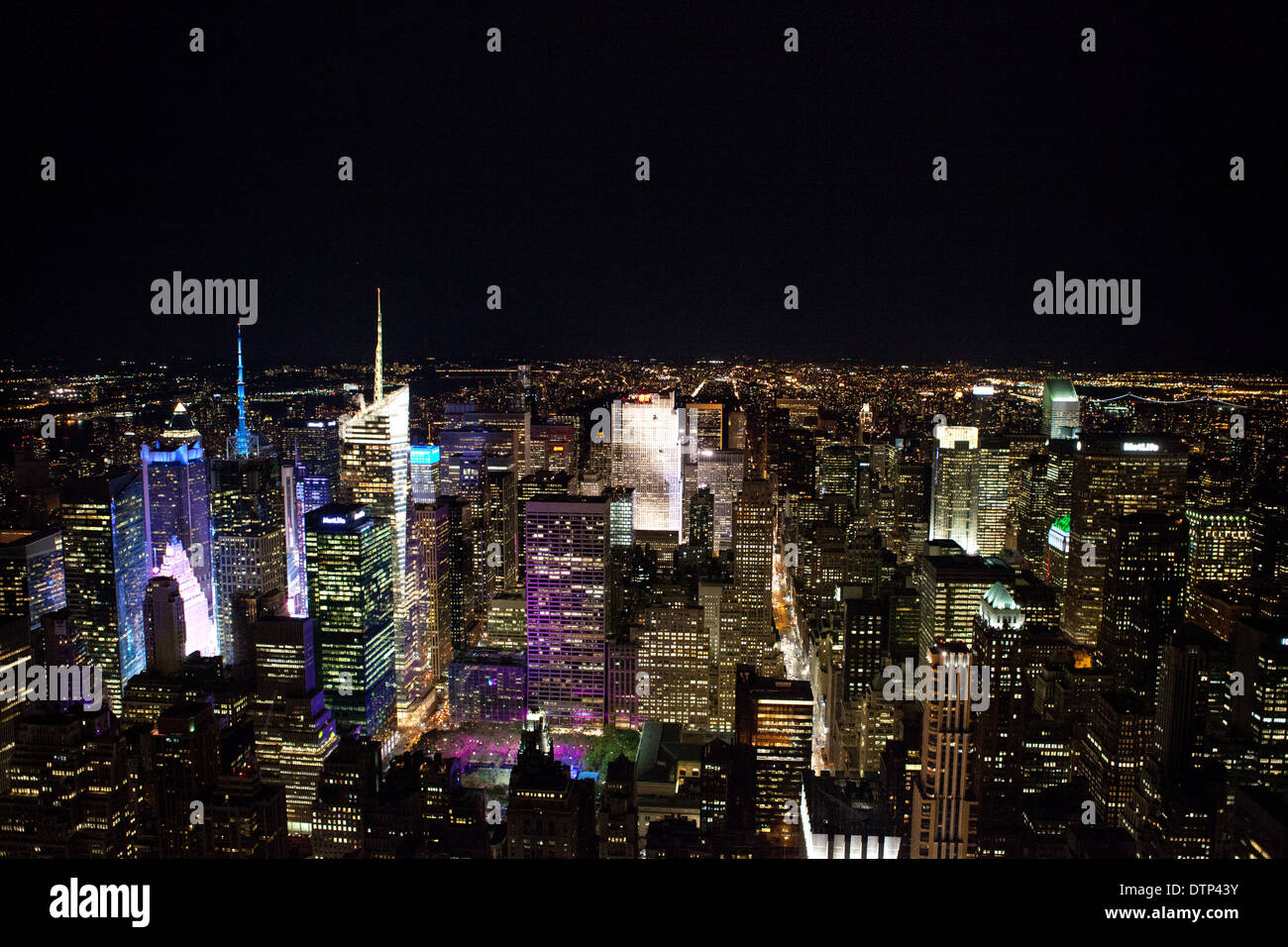 new york city skyline at nite, the colored buildings show times square Stock Photo