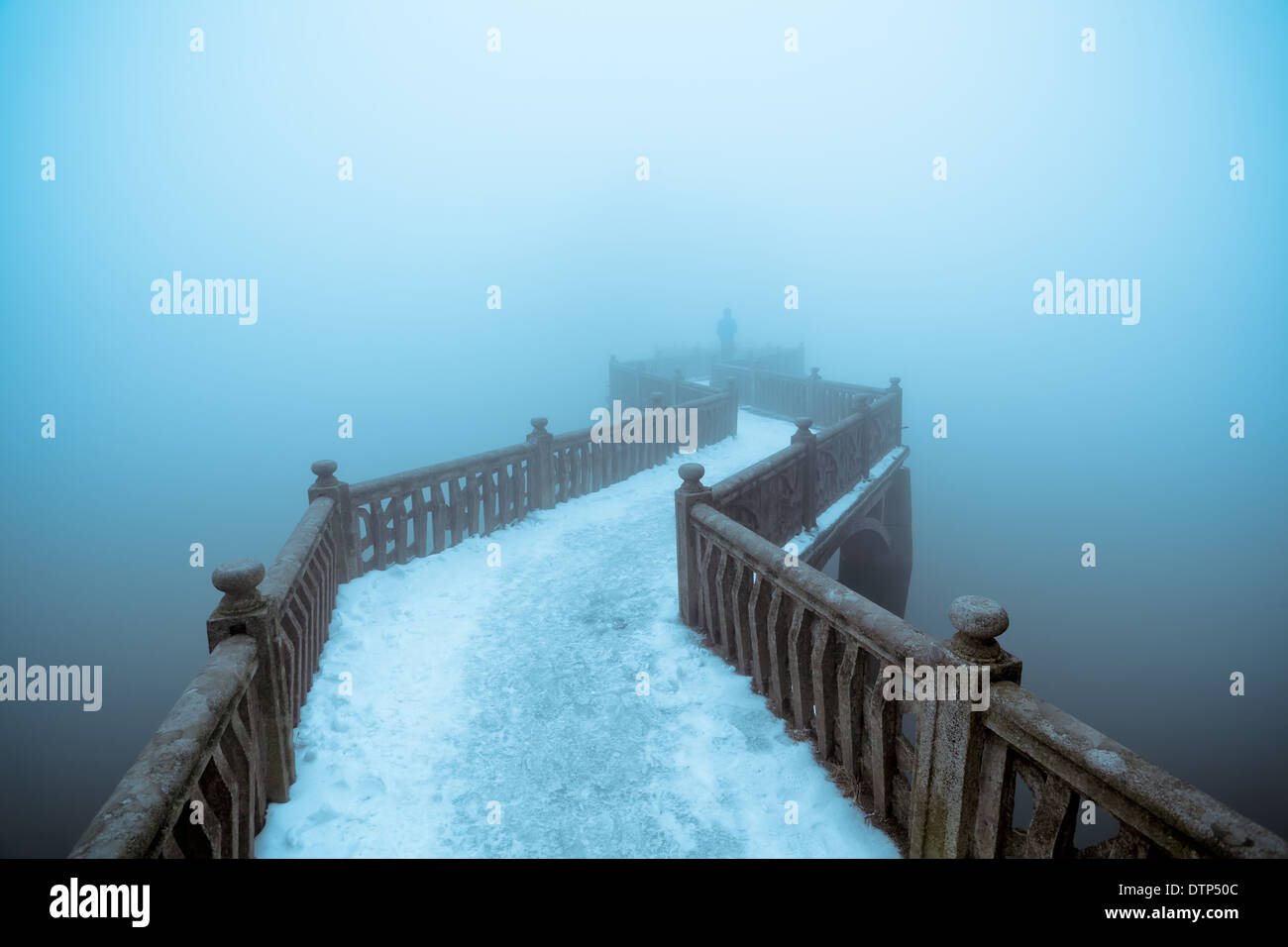 zigzag bridge in winter fog Stock Photo
