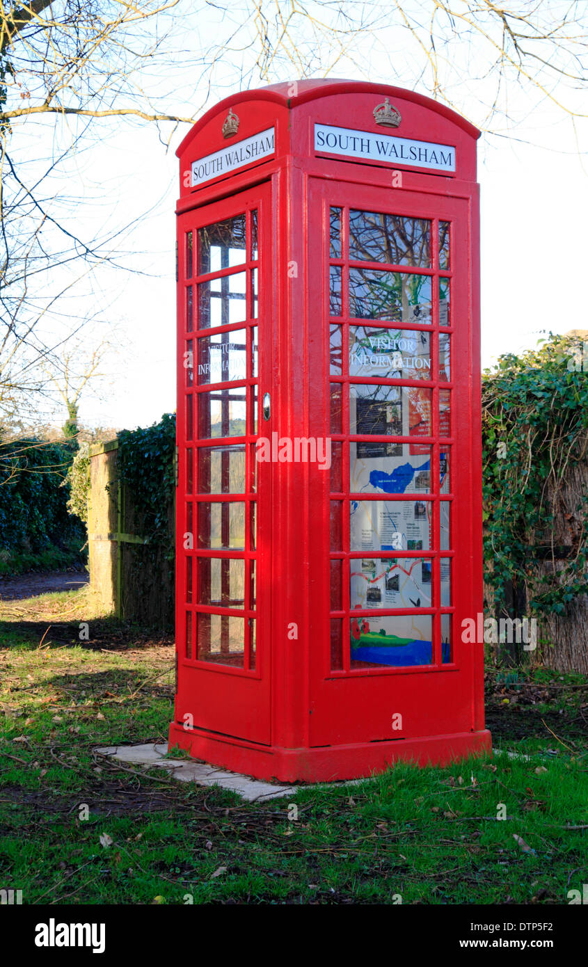 A red telephone box converted to a visitor information kiosk on the Norfolk Broads at South Walsham, Norfolk, England, UK. Stock Photo
