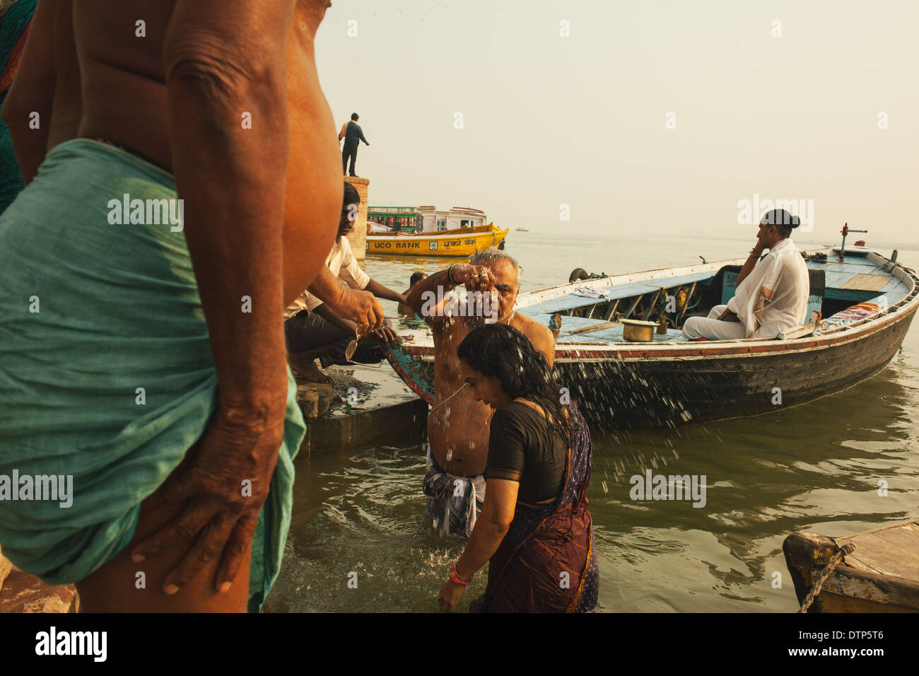 A couple bathing in the ganges, Varanasi, India Stock Photo