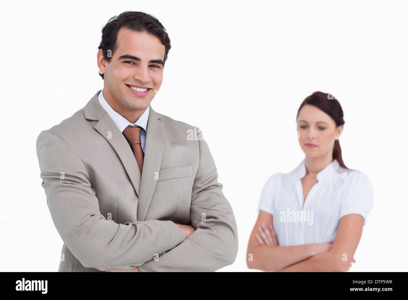 Smiling salesman with colleague behind him Stock Photo - Alamy