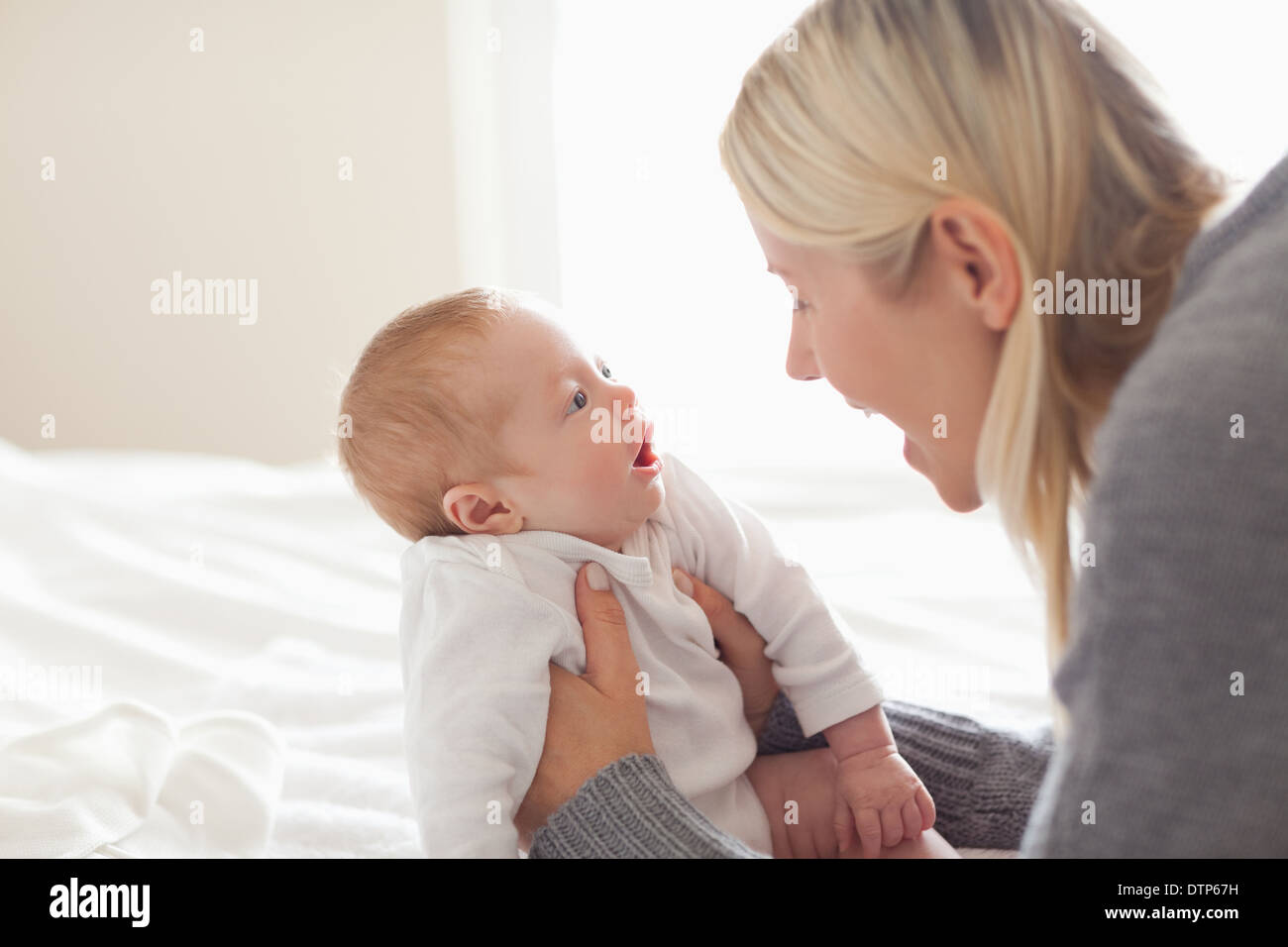 Affectionate mom holding her newborn Stock Photo