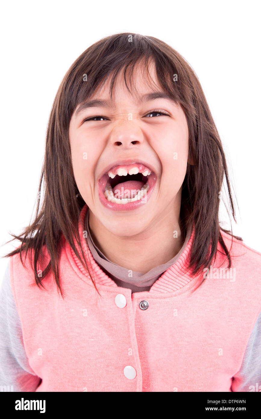Funny young girl making faces isolated in white Stock Photo