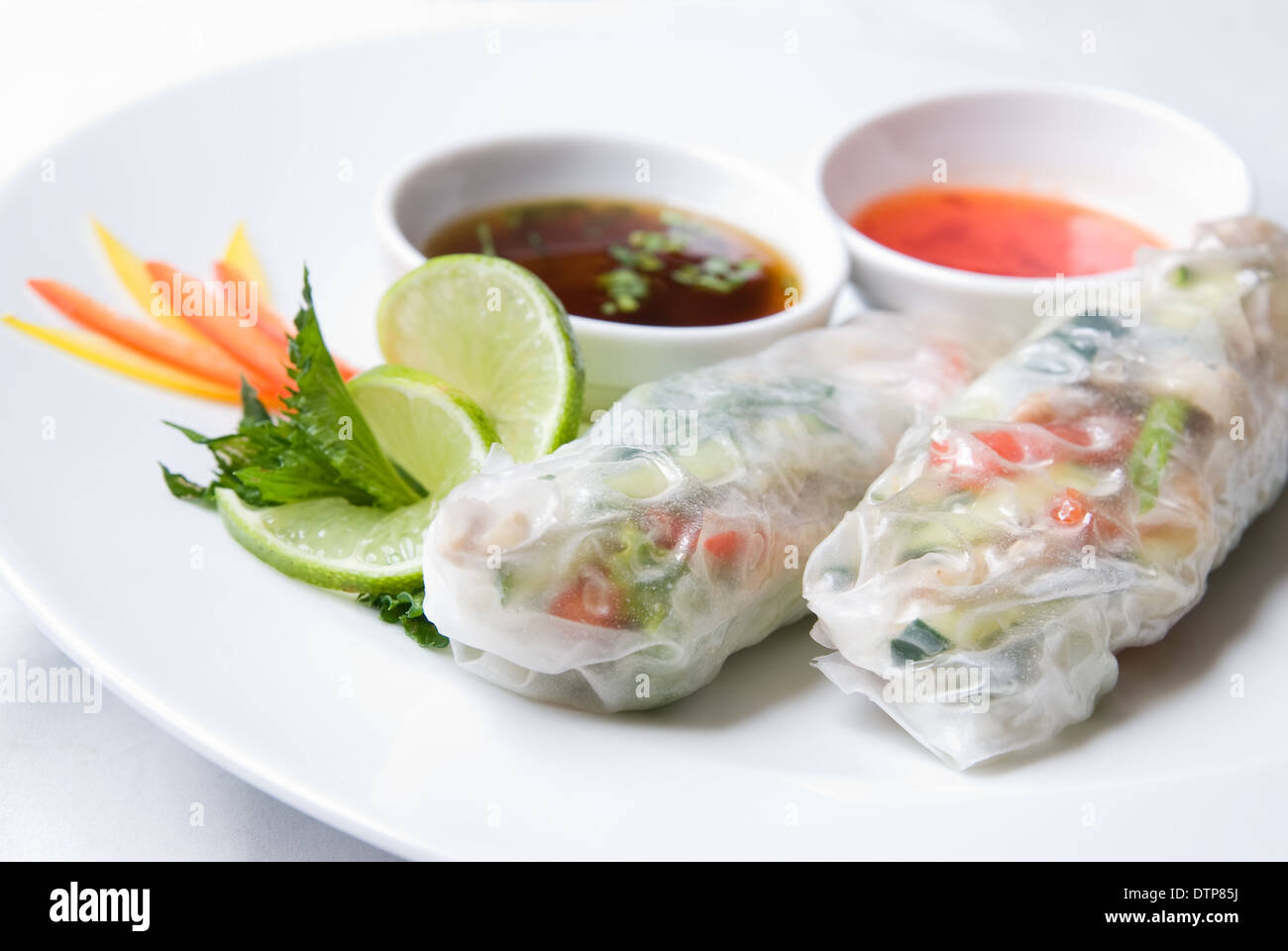 chinese rolls with vegetables on the plate Stock Photo