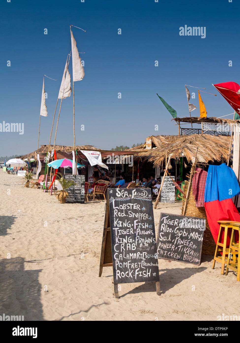 India, Goa, Morjim beach, chalkboard seafood menu outside shack cafe