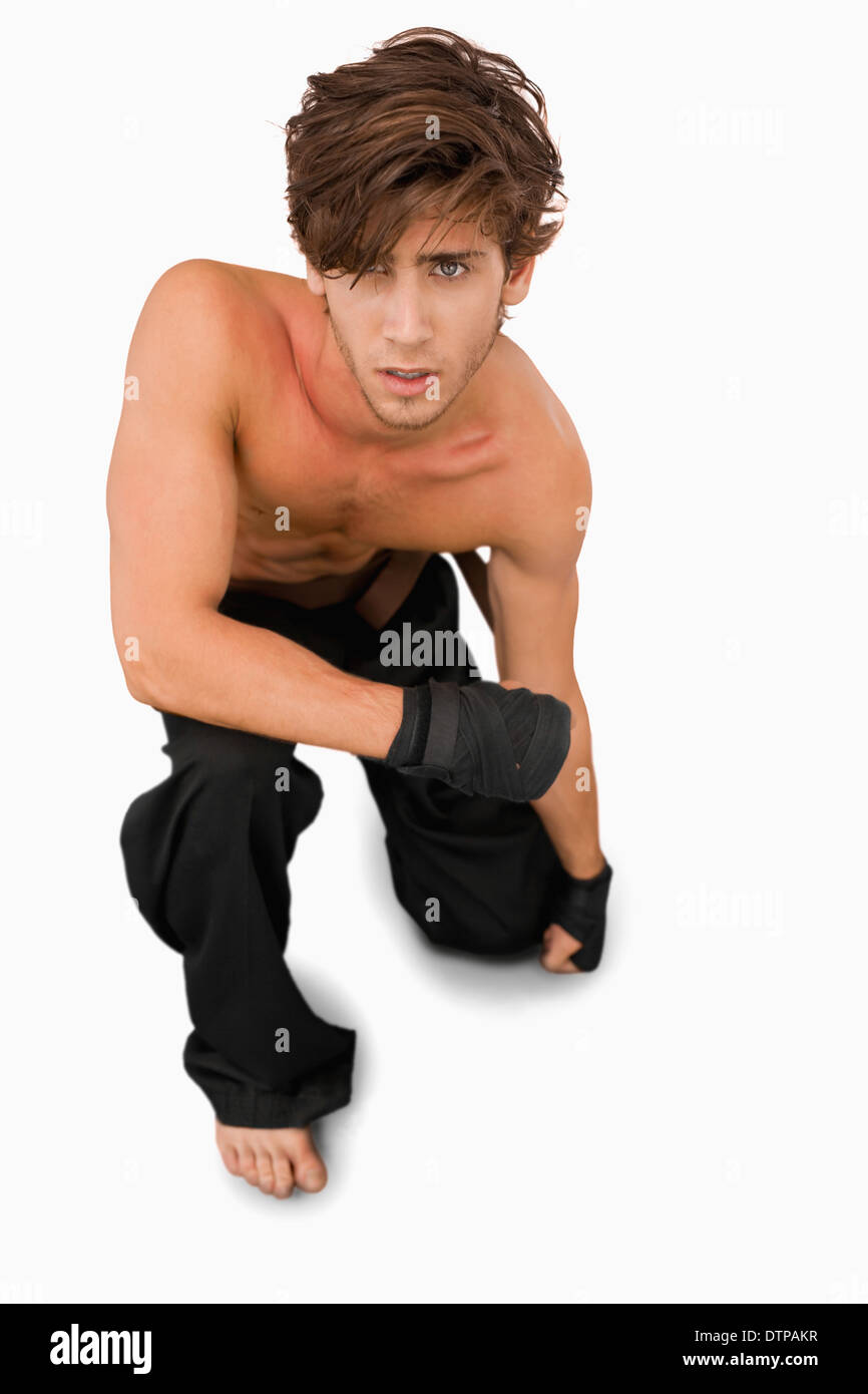 Martial arts fighter on his knees Stock Photo Alamy