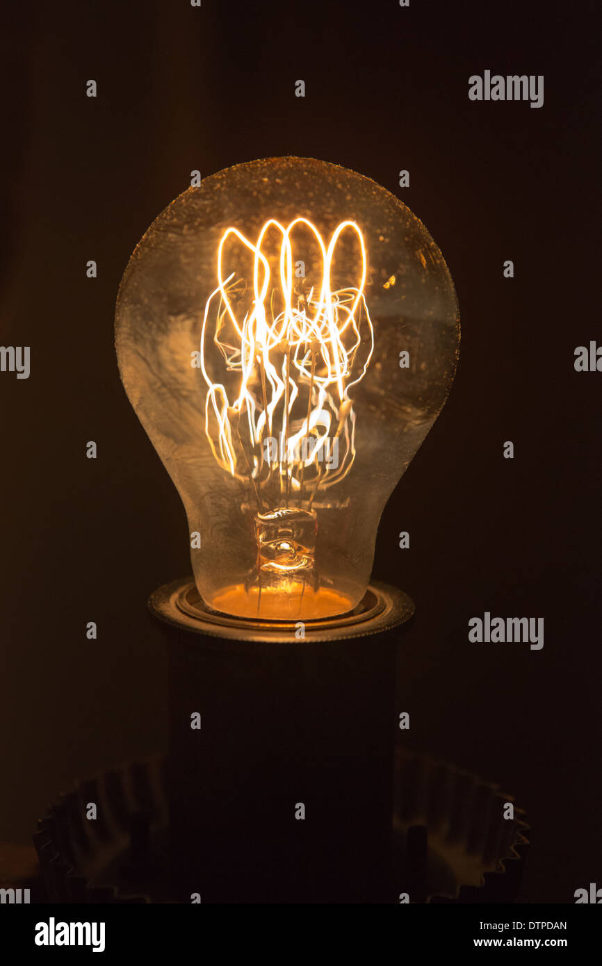 An old style electric light bulb with a coiled filament Stock Photo Alamy