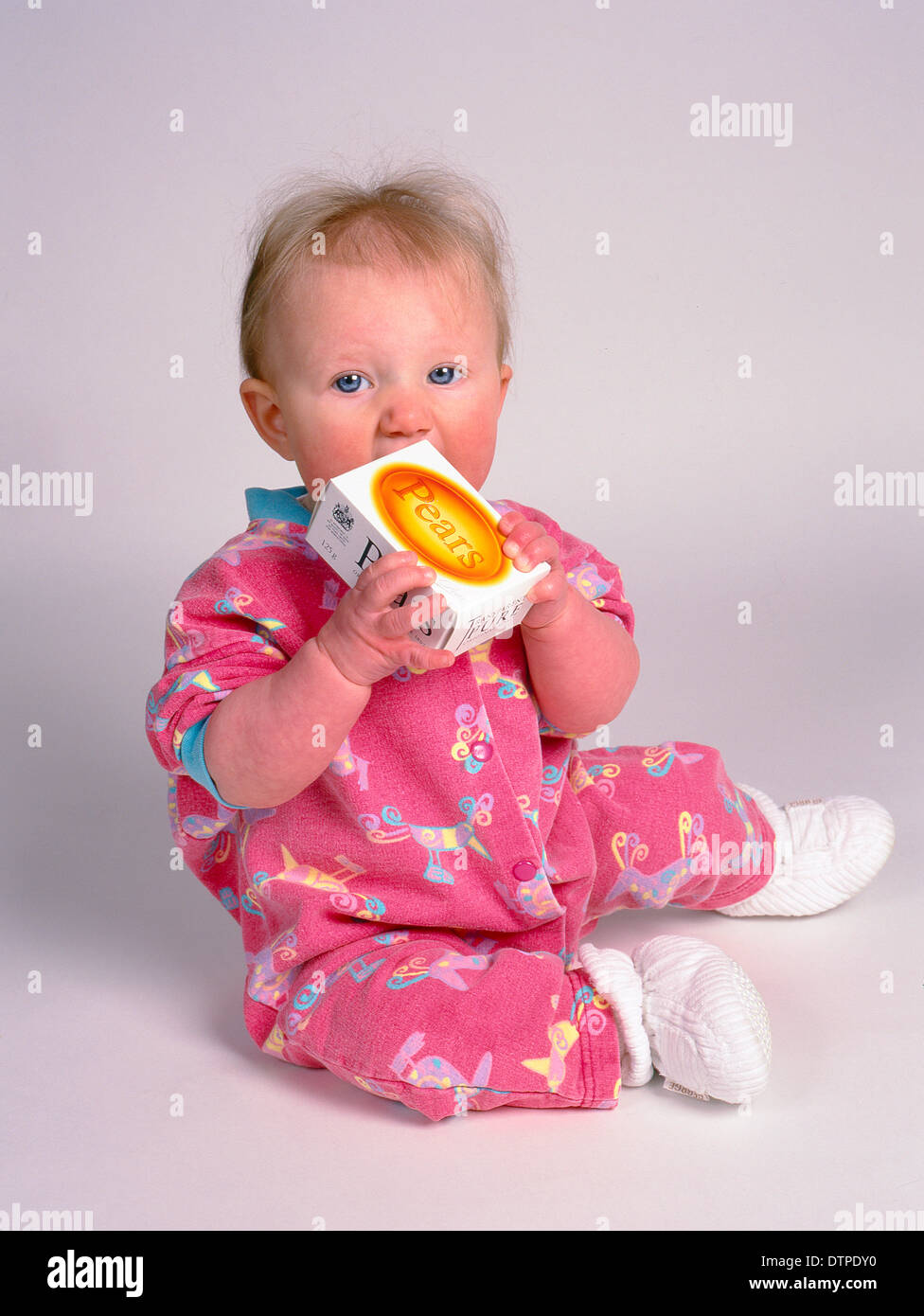 angelic child holding pears soap Stock Photo