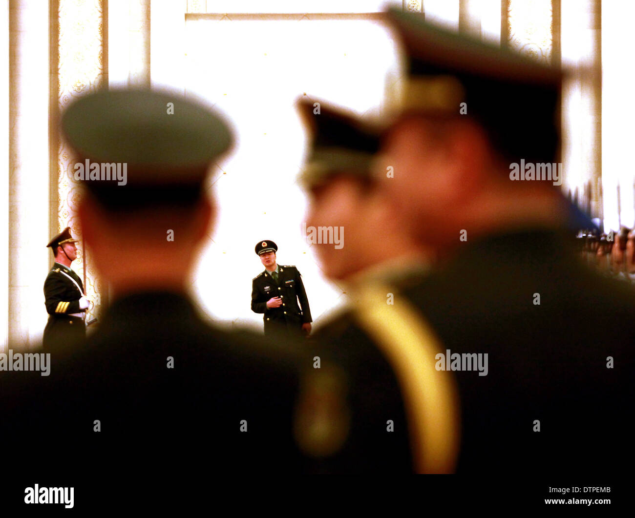 Beijing, CHINA, China. 19th Feb, 2014. Chinese soldiers perform military honor guard duties during a welcoming ceremony at the Great Hall of the People in Beijing on February 19, 2014. Soldiers in China's army have grown so big that they no longer fit comfortably in their tanks, according to research by the military. After surveying nearly 20,000 ground-force soldiers, the military found that their average physique had increased by 2 cm in height and 5 cm in waist girth over the past two decades. © Stephen Shaver/ZUMAPRESS.com/Alamy Live News Stock Photo