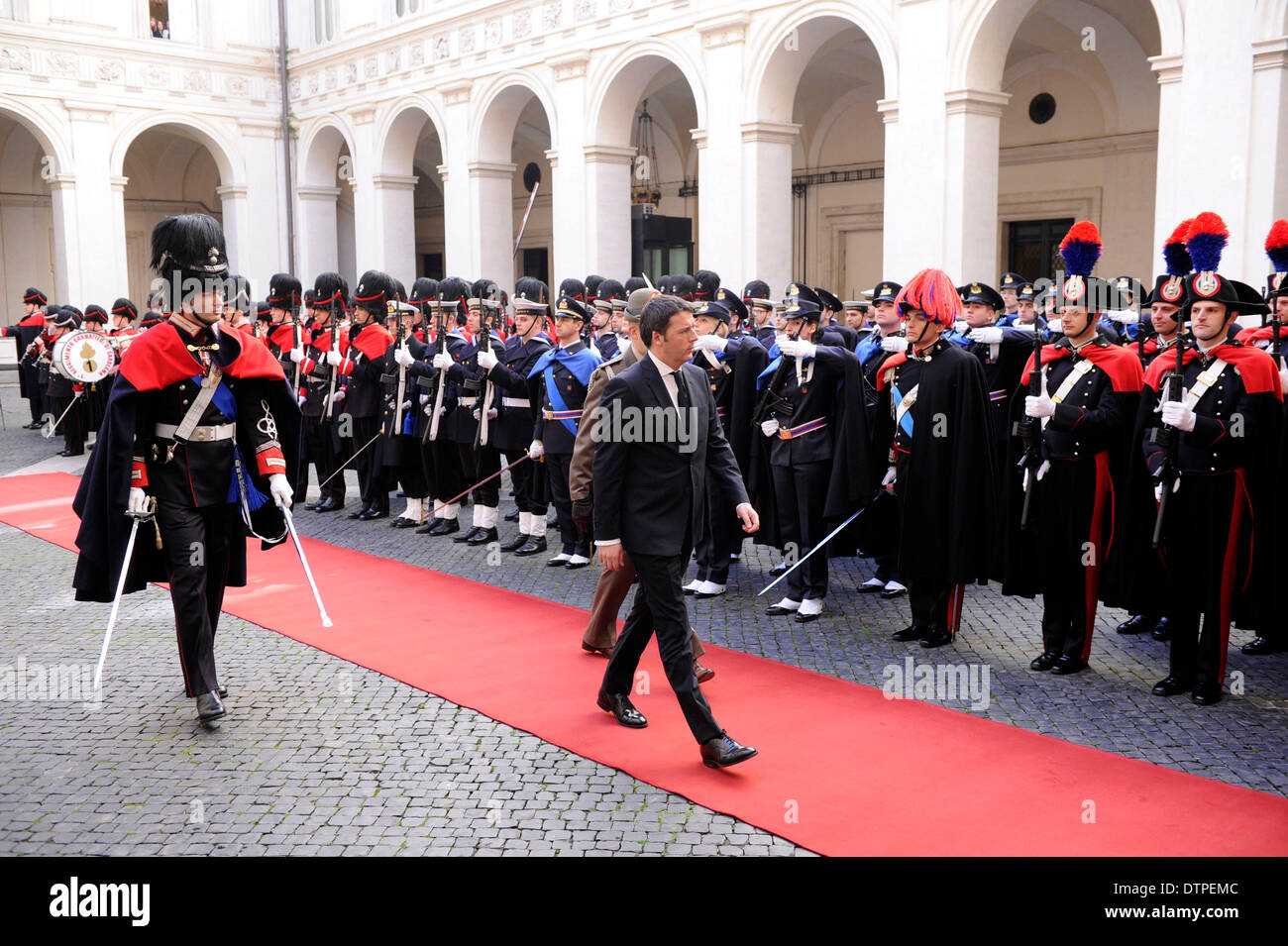 Rome, Italy. 22nd Feb, 2014. Italy'new prime minister Matteo Renzi inspects the guard of honor at the prime minister's office in Rome on February 22, 2014. Italy's new prime minister Matteo Renzi and his cabinet ministers were sworn in on Saturday before Italian President Giorgio Napolitano, starting their task to accelerate reforms and revive the troubled economy. Credit:  Alberto Lingria/Xinhua/Alamy Live News Stock Photo
