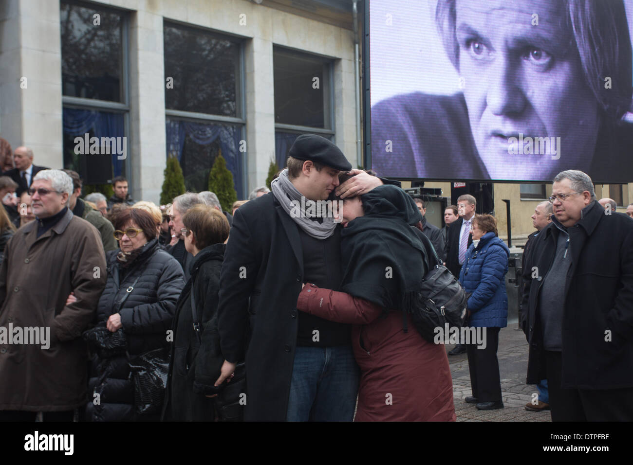 Budapest, Hungary. 22nd Feb, 2014. People attend the funeral of Hungarian film director Miklos Jancso at the Fiumei Road cemetery in Budapest, Hungary, on Feb. 22, 2014. The Internationally recognized film director Miklos Jancso died of illness on January 31 at the age of 92. His unique style consisted of long takes, rural settings and often the juxtapositioning of black on white. His best known works include 'The Round Up', 'The Red and the White' and 'Red Psalm'. Credit:  Attila Volgyi/Xinhua/Alamy Live News Stock Photo