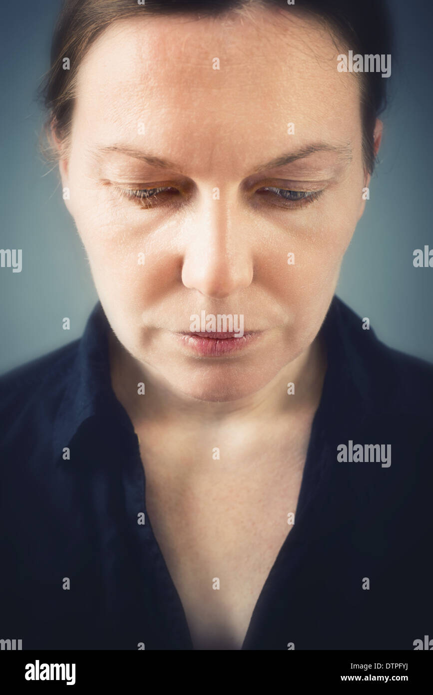 Close up portrait of sad woman with selective focus Stock Photo