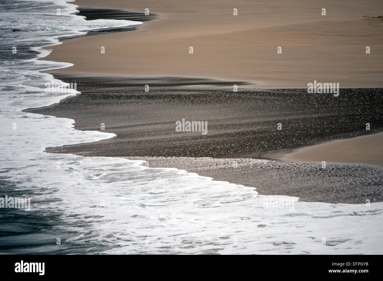 Curving white tide line on Carbis Bay Beach Stock Photo