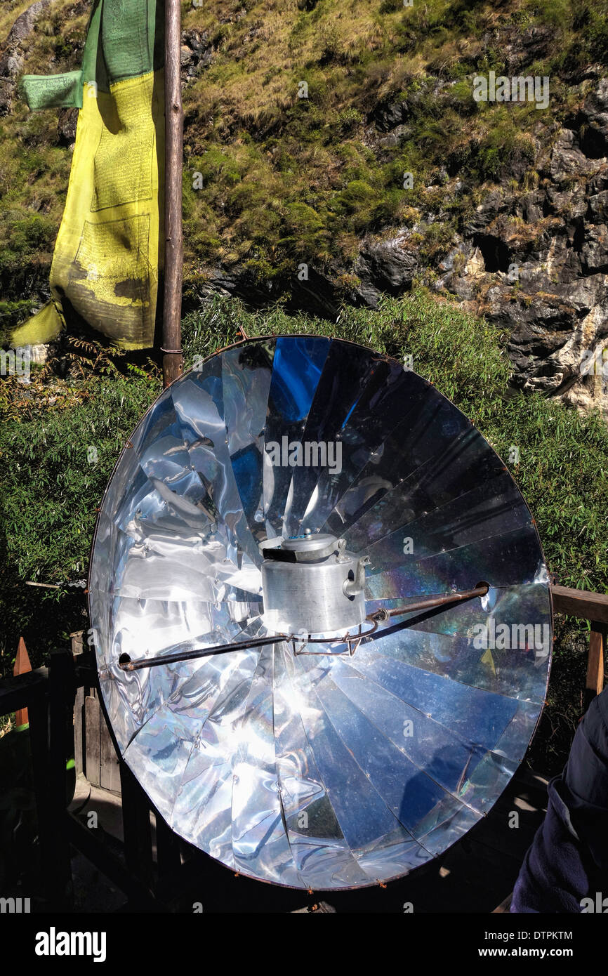 Heating a kettle of water on a solar cooker at a restaurant in the Manaslu region in Nepal. Stock Photo